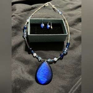 Blue and silver necklace and earring set.
